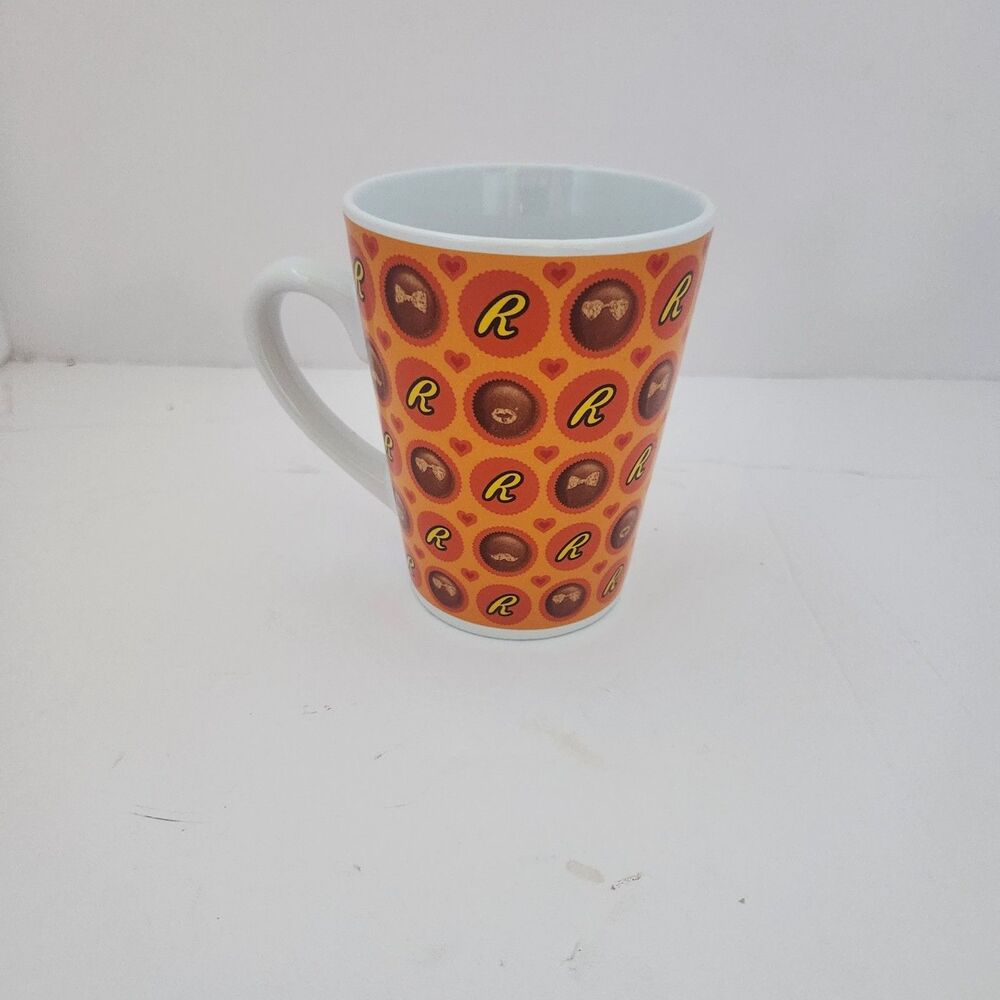 Galerie Reeses pieces tall mug features butter cups and logo